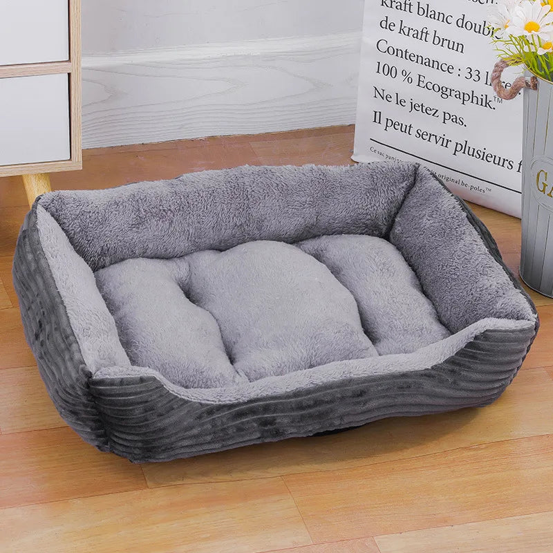 Light heather grey and silver-toned square pet bed with plush fiber filling and soft-touch fabric.